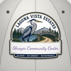 Close-up of the Shroyer Community Center heron logo on the front of the light gray cap