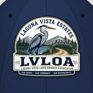 Close-up of the heron logo on the front of the navy cap