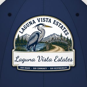 Close-up of the script heron logo on the front of the navy cap