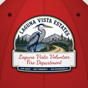 Close-up of the Laguna Vista Volunteer Fire Department heron logo on the front of the red cap