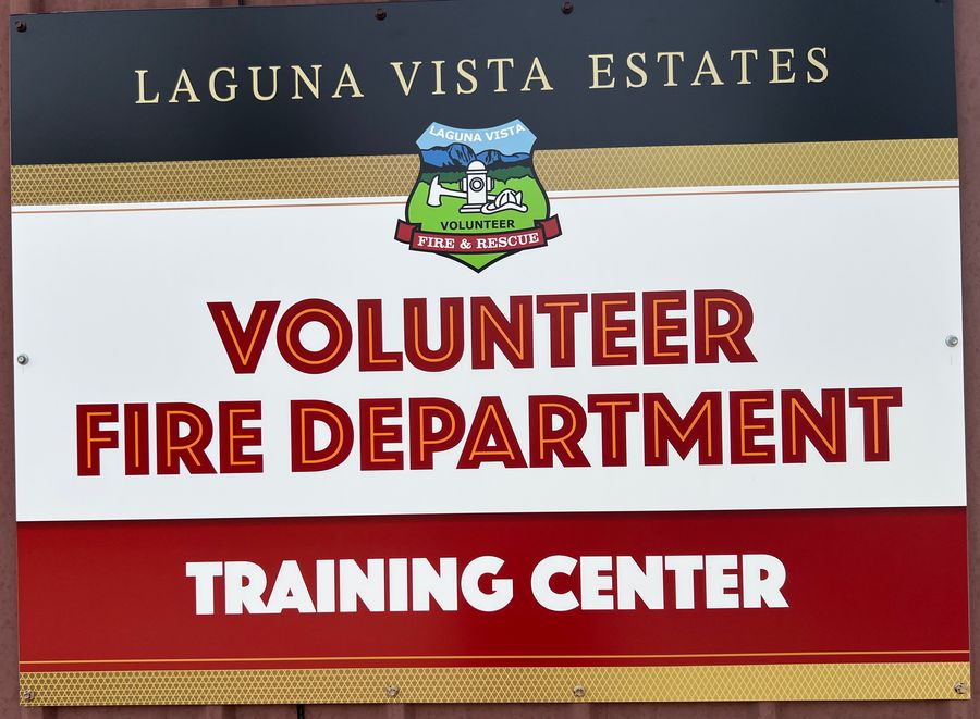 Sign on the station wall: Laguna Vista Estates Volunteer Fire Department Training Center, with the Laguna Vista Volunteer Fire & Rescue badge