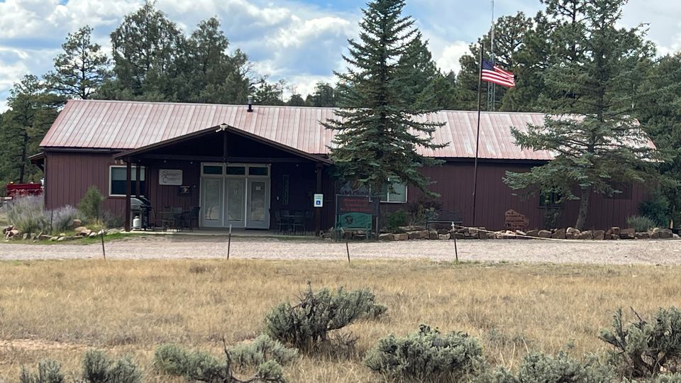 The Shroyer Community Center with its covered porch and flag